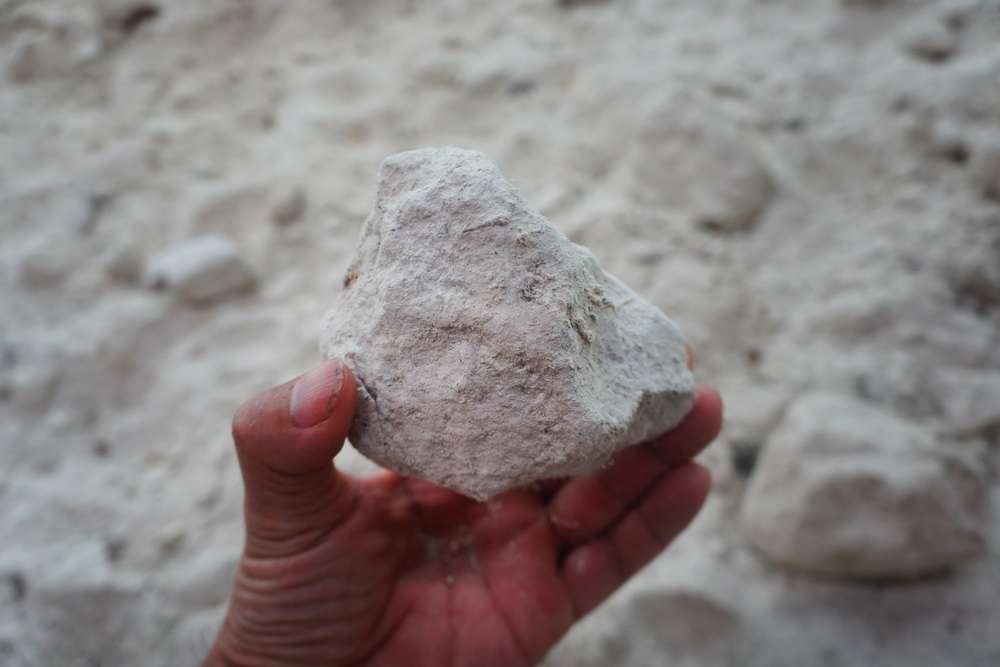 kaolin clay stone in hand