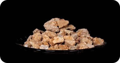 Industrial grade bentonite clay in lumps, used for drilling, foundry, and oil refining applications