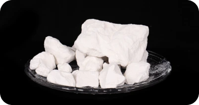 Industrial grade kaolin clay lumps used in ceramics, refractories, and mineral processing